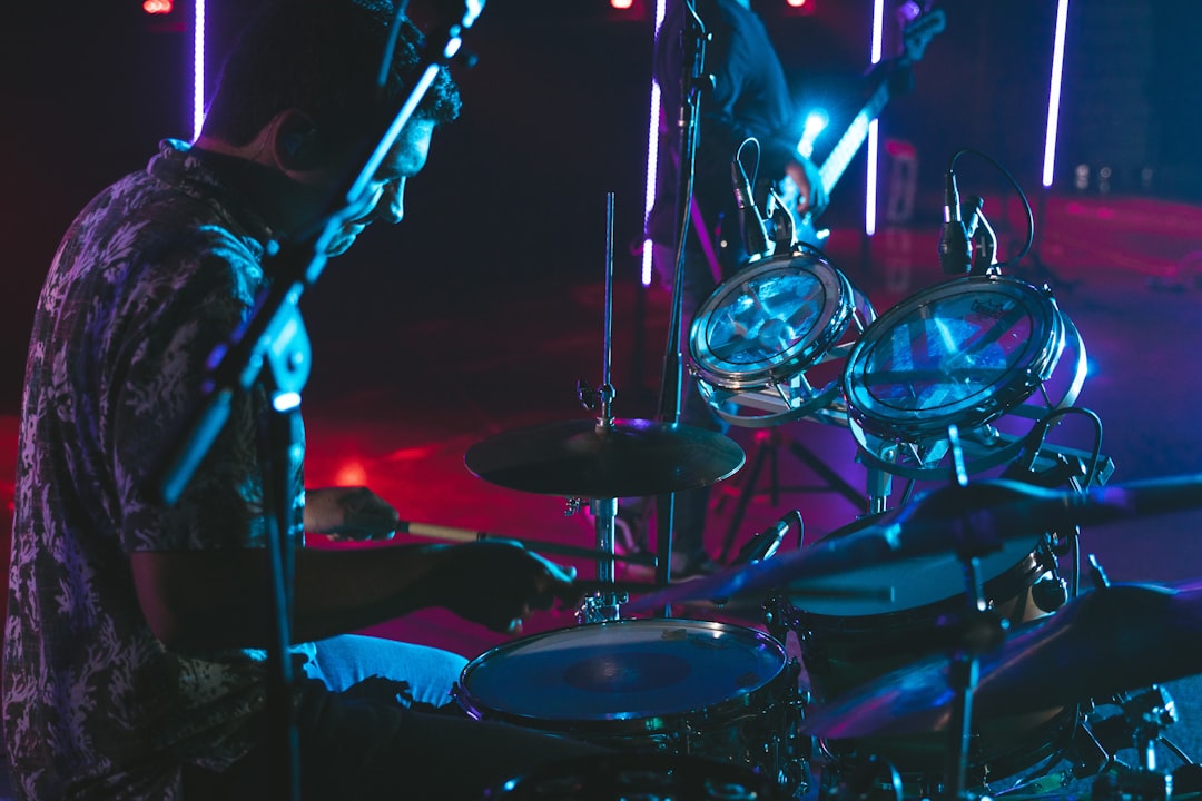 man playing drum on stage
