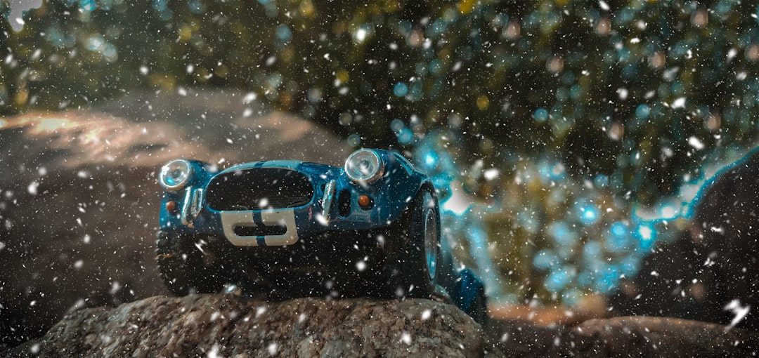blue bmw m 3 on snow covered ground